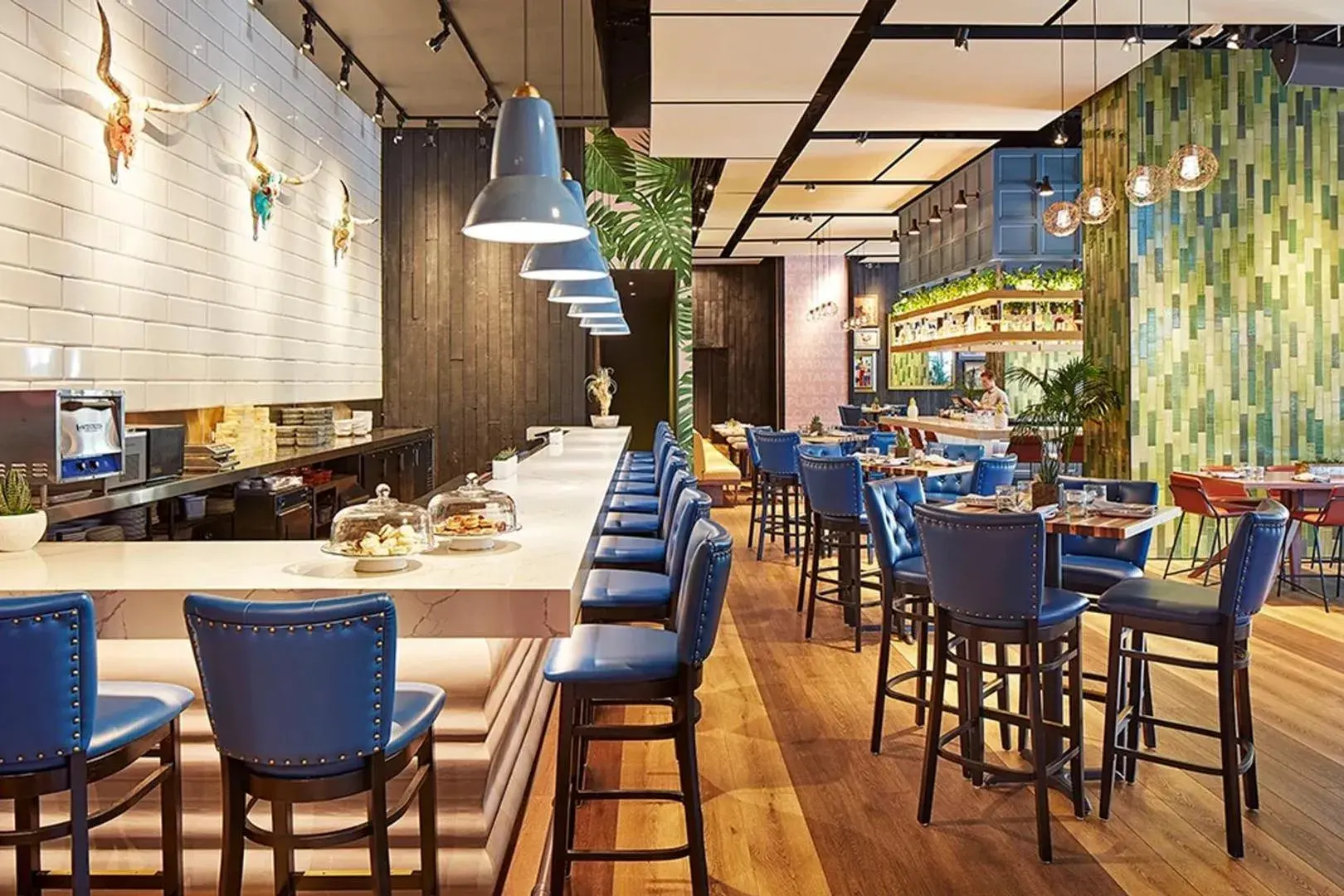 Restaurant interior with bar seating and architectural finishes