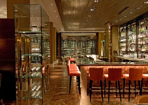 Restaurant bar with integrated wine storage and display cabinetry