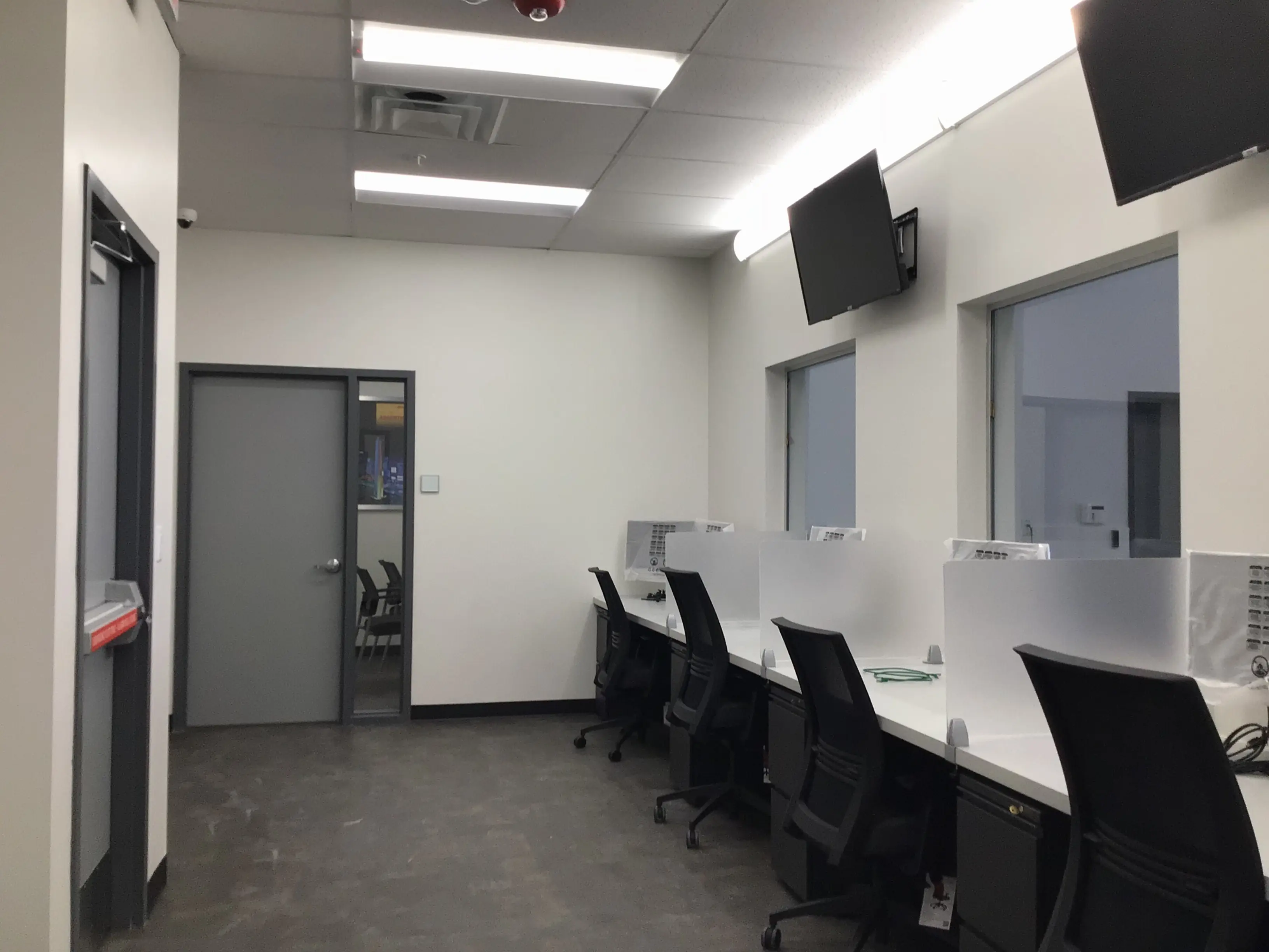 Commercial door and hardware installation within a finished interior opening
