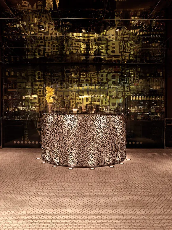 Restaurant entrance with patterned glass and integrated lighting