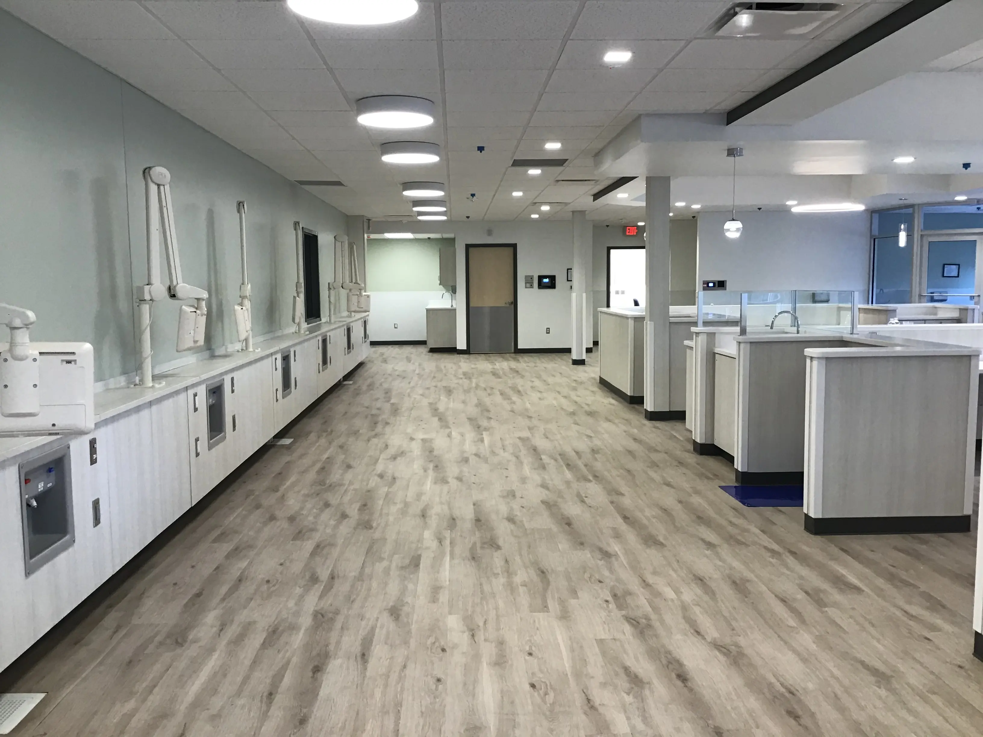 Circulation through a completed Pure Life workroom with millwork and lighting