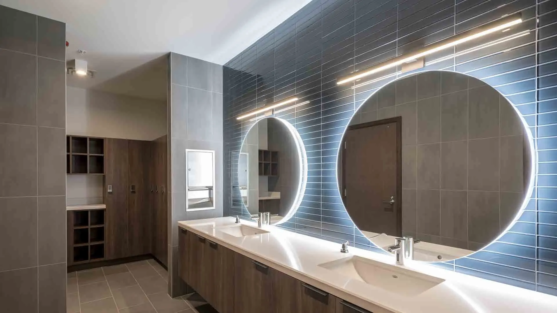 Locker room vanity and illuminated mirrors at F3 Marina