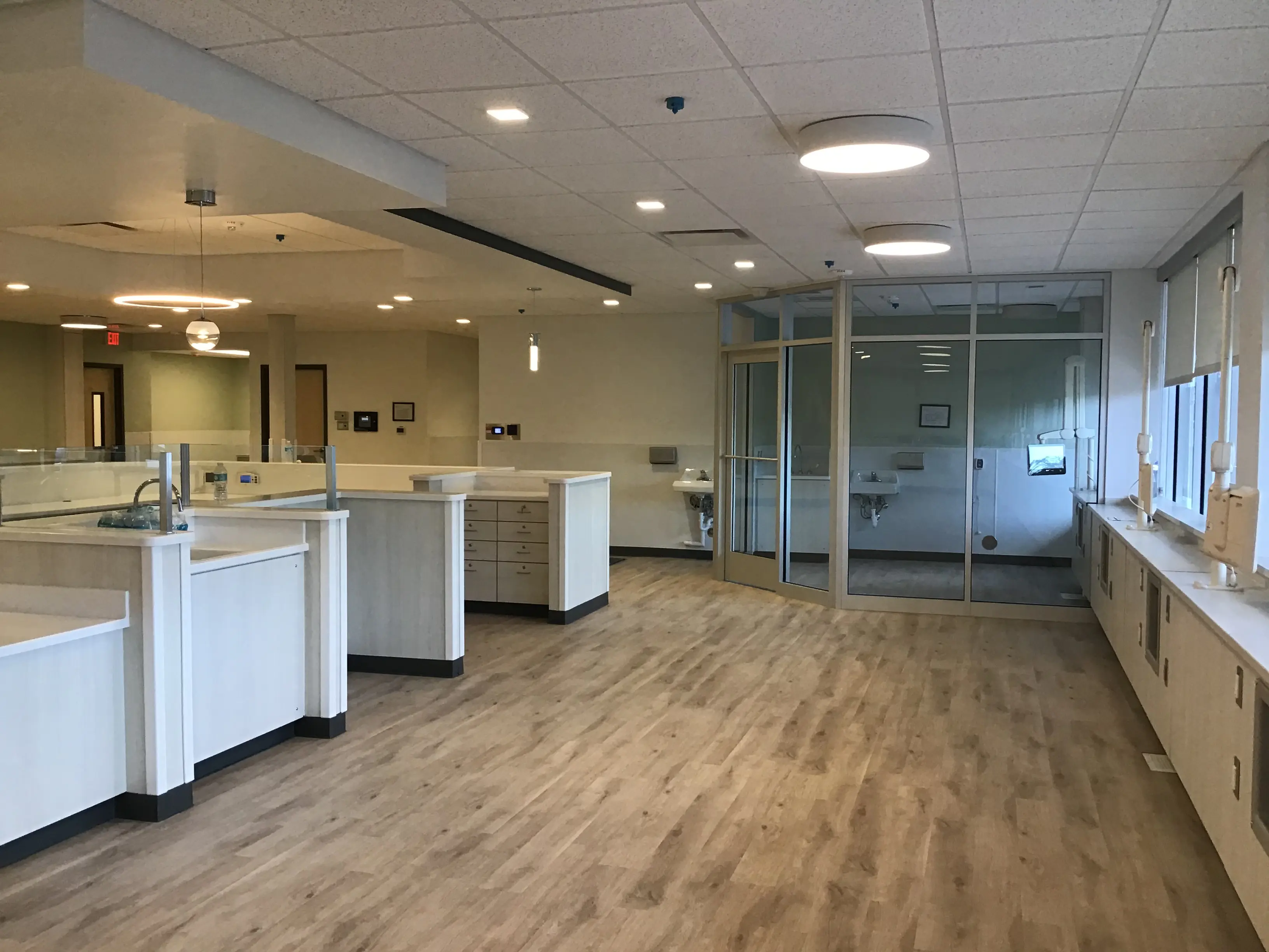 Completed Pure Life interior with workstations, glass partitions, and coordinated finishes