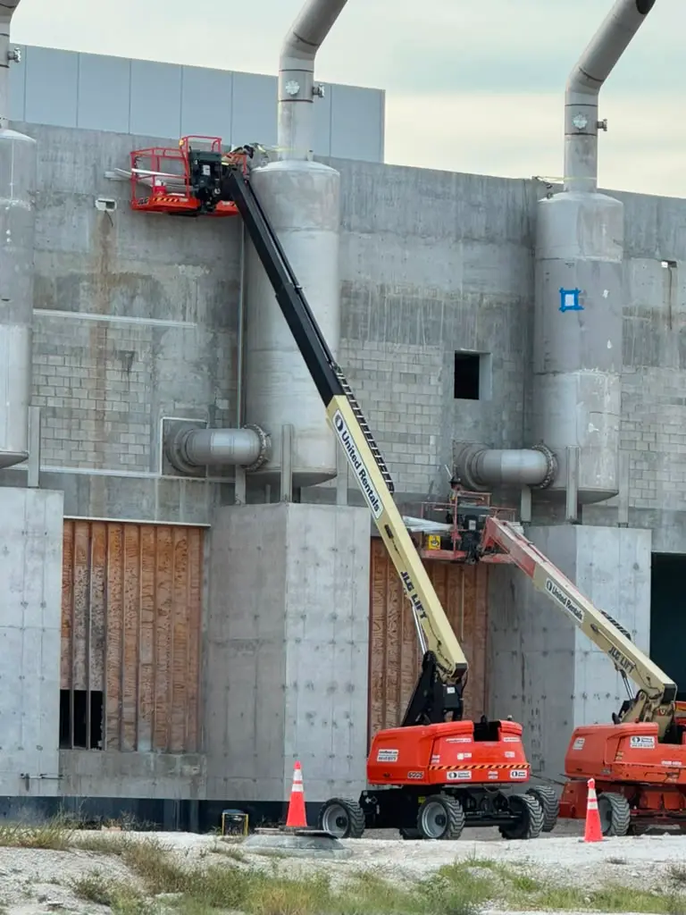 Active industrial envelope work with lifts coordinated around building systems