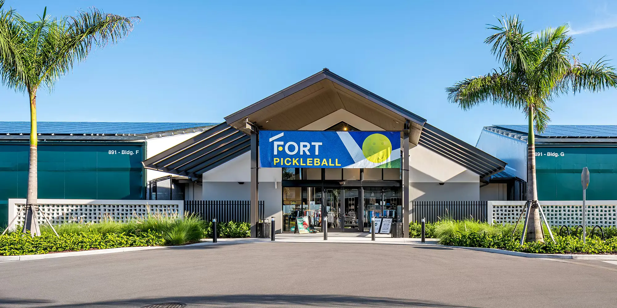 Outdoor architecture and landscaped circulation at The Fort Pickleball